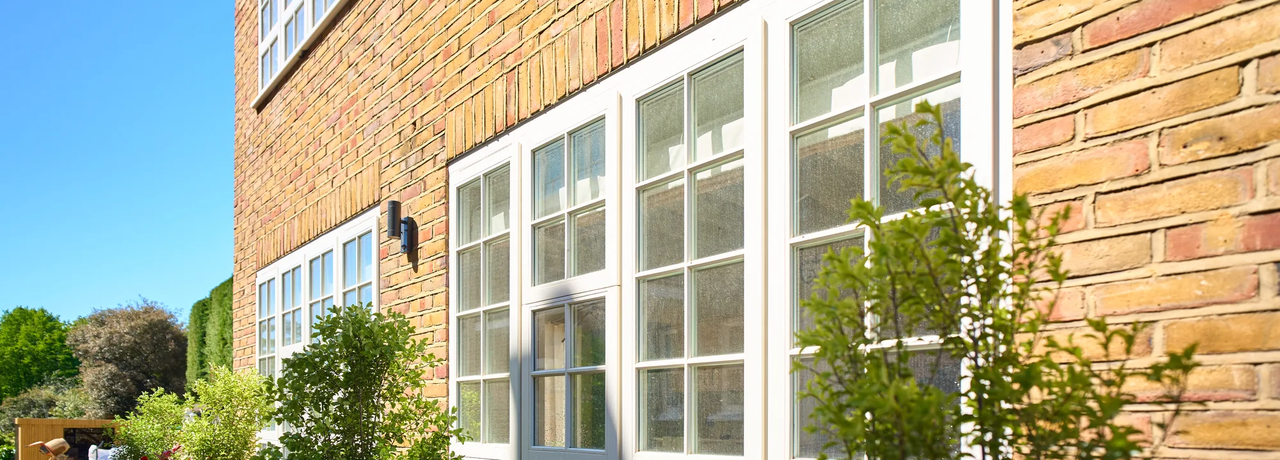 Double-glazed<br/>timber sash<br/><em>windows</em>.
