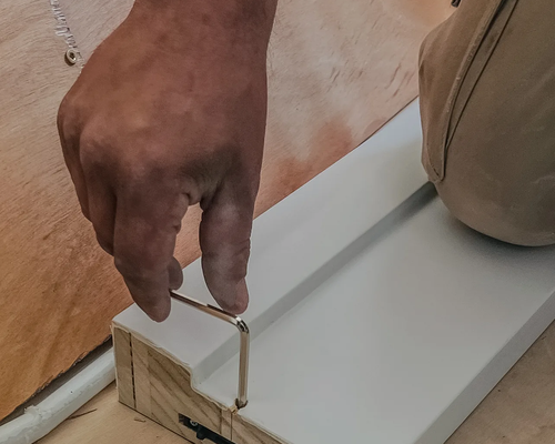 Hand-finishing a window on site