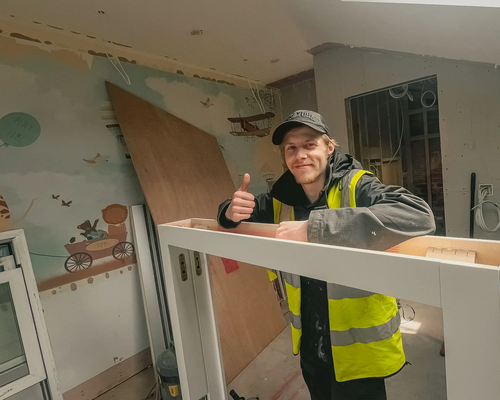 Worker holding a finished white window